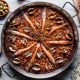 Woher kommt der spanische Klassiker - die Paella?